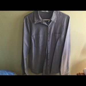 Maurice’s blue button-down shirt